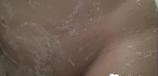  Beautiful chick pleasures herself while taking a shower